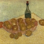 Korb mit Zitronen und Flasche